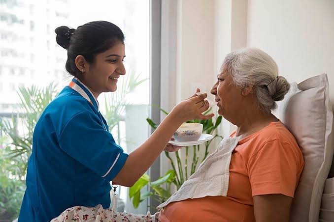 Professional caregiver providing compassionate elderly care at home